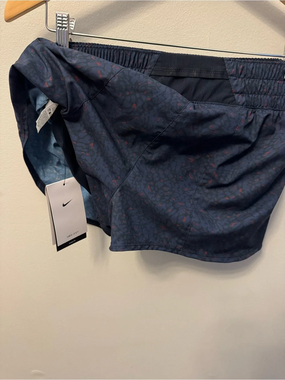 Nike Women’s Dark Navy Athletic Shorts with Subtle Red Print
